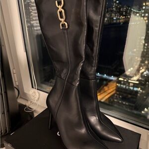 BCBGeneration Sleek Black Boots with Gold Accent